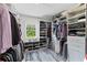 Walk-in closet with built-in shelving and drawers at 3663 Berger Rd, Lutz, FL 33548