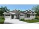 Charming single-story home featuring a symmetrical façade, two-car garage and inviting blue front door at 4590 Southern Valley Loop, Brooksville, FL 34601