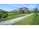 Well-manicured backyard with black metal fence and green grass at 4608 Emprise Way, Land O Lakes, FL 34638