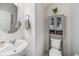 Half bathroom featuring a sleek sink and vanity with a coordinating storage cabinet at 4608 Emprise Way, Land O Lakes, FL 34638