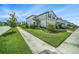 Beautifully landscaped front yard, complemented by a sidewalk at 4608 Emprise Way, Land O Lakes, FL 34638