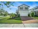 Beautifully landscaped front yard, complemented by a red brick driveway at 4608 Emprise Way, Land O Lakes, FL 34638