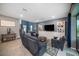 Comfortable living room features recessed lights, a ceiling fan, and neutral-toned walls at 4608 Emprise Way, Land O Lakes, FL 34638