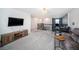Open loft area with comfortable seating, perfect for relaxing or entertaining with railing overlooking the stairwell at 4608 Emprise Way, Land O Lakes, FL 34638
