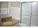 Bathroom featuring granite vanity, toilet, and shower with sliding doors at 4702 Michael Ct # 139, Tampa, FL 33614
