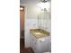 Bathroom vanity with granite counters, stylish mirror, and white tiled walls at 4702 Michael Ct # 139, Tampa, FL 33614