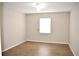 A bright bedroom with wood laminate flooring and a ceiling fan at 4702 Michael Ct # 139, Tampa, FL 33614
