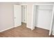 Bedroom with an open closet and wood floors at 4702 Michael Ct # 139, Tampa, FL 33614