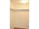A well-lit closet with white walls, a hanging rod and wooden flooring at 4702 Michael Ct # 139, Tampa, FL 33614