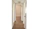 Hallway featuring neutral paint, wood floors and white trim at 4702 Michael Ct # 139, Tampa, FL 33614