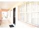 External shot of a hallway that includes security bars on the windows and doors and a covered hallway ceiling at 4702 Michael Ct # 139, Tampa, FL 33614