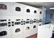 Community laundry room with multiple rows of newer model washers and dryers at 4702 Michael Ct # 139, Tampa, FL 33614