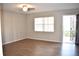 The home features an open living room area with wood floors, a ceiling fan, and ample natural light at 4702 Michael Ct # 139, Tampa, FL 33614