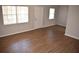 Bright living room features wood floors, large windows, and a neutral color scheme, creating a welcoming space at 4702 Michael Ct # 139, Tampa, FL 33614