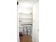 A well-organized pantry with shelves, paint cans, and a broom at 4702 Michael Ct # 139, Tampa, FL 33614