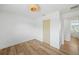 Bedroom features wood-look floors, a closet and view to the en suite bathroom at 4704 W Fairview Hts, Tampa, FL 33616