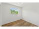 Bedroom with hardwood floors, updated ceiling fan and a sun-filled window at 4704 W Fairview Hts, Tampa, FL 33616