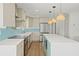 Bright kitchen featuring a large island, stainless steel appliances, and eye-catching backsplash at 4704 W Fairview Hts, Tampa, FL 33616