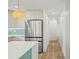Open kitchen features modern appliances, backsplash, island and pendant lighting at 4704 W Fairview Hts, Tampa, FL 33616