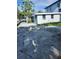 Spacious backyard with concrete pad area, bordered by a white picket fence, offers privacy at 507 Danube Ave, Tampa, FL 33606
