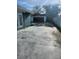 Large driveway with access to a detached garage, ideal for additional parking or storage at 507 Danube Ave, Tampa, FL 33606