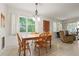 A brightly lit dining room with a wooden table and chair set at 5391 54Th N St, St Petersburg, FL 33709