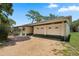 Charming single-story home with a two-car garage and gravel driveway at 5391 54Th N St, St Petersburg, FL 33709