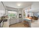 A bright kitchen with an open layout next to the dining room at 5391 54Th N St, St Petersburg, FL 33709