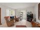 Bright living room with a slider to a patio, comfortable seating and a flatscreen television at 5391 54Th N St, St Petersburg, FL 33709
