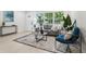 Cozy living room with ample natural light, comfortable seating, and a stylish rug at 6 N Orion Ave, Clearwater, FL 33765