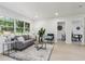 Airy living room featuring modern furnishings, neutral walls, and plenty of natural light at 6 N Orion Ave, Clearwater, FL 33765