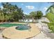 Backyard with a sparkling pool, a hot tub, and ample space for outdoor entertaining at 6 N Orion Ave, Clearwater, FL 33765