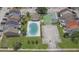 Aerial view highlighting the community pool, tennis courts, and well-manicured green spaces at 6601 121St Ave # I, Largo, FL 33773