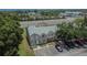 Aerial view of townhome exterior featuring well-kept grounds and ample parking at 6601 121St Ave # I, Largo, FL 33773
