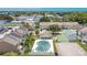 A vibrant community featuring a pool, tennis courts, and landscaped common areas at 6601 121St Ave # I, Largo, FL 33773