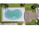 Overhead view showcases the pool, clubhouse, and ample deck space for entertaining at 6601 121St Ave # I, Largo, FL 33773