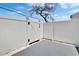 Fenced backyard with low-maintenance landscaping and secure gate access at 6601 121St Ave # I, Largo, FL 33773