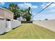 Wide backyard area with well-maintained grass and a secure fence for privacy at 6601 121St Ave # I, Largo, FL 33773
