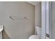 Stylish half-bathroom features a toilet, brushed nickel towel rack and neutral paint at 6601 121St Ave # I, Largo, FL 33773