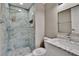 Modern bathroom featuring stunning blue marble tile in walk-in shower and pebble flooring at 6601 121St Ave # I, Largo, FL 33773