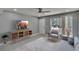 Cozy living room featuring neutral tones, tile floors, ceiling fan, and natural light at 6601 121St Ave # I, Largo, FL 33773