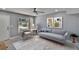 Comfortable living room with modern furnishings, soft rug, and lots of natural light at 6601 121St Ave # I, Largo, FL 33773