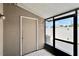Enclosed patio featuring white tile flooring and a doorway for convenient outdoor access at 6601 121St Ave # I, Largo, FL 33773