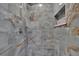 A luxurious shower with blue marble tiling and a sleek, modern rain shower head at 6601 121St Ave # I, Largo, FL 33773
