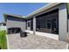 Backyard with a BBQ grill, small fire pit and partial view of the covered patio at 6648 Castle Green Pl, Zephyrhills, FL 33541