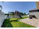 Backyard with a playset, green grass and view of a lake at 6648 Castle Green Pl, Zephyrhills, FL 33541
