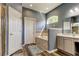 Bathroom with tub, a window for natural light, and vanity with sink at 6648 Castle Green Pl, Zephyrhills, FL 33541