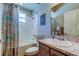 Bathroom featuring shower/tub combo and vanity with ample counter space at 6648 Castle Green Pl, Zephyrhills, FL 33541