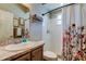 Well-lit bathroom featuring a shower-tub combo and classic vanity at 6648 Castle Green Pl, Zephyrhills, FL 33541