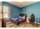 This bedroom features a blue Tampa Bay Lightning theme and modern desk area at 6648 Castle Green Pl, Zephyrhills, FL 33541